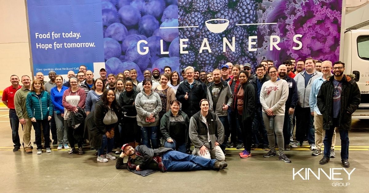A group of engaged Kinney Group employees volunteering at Gleaners Food Bank.